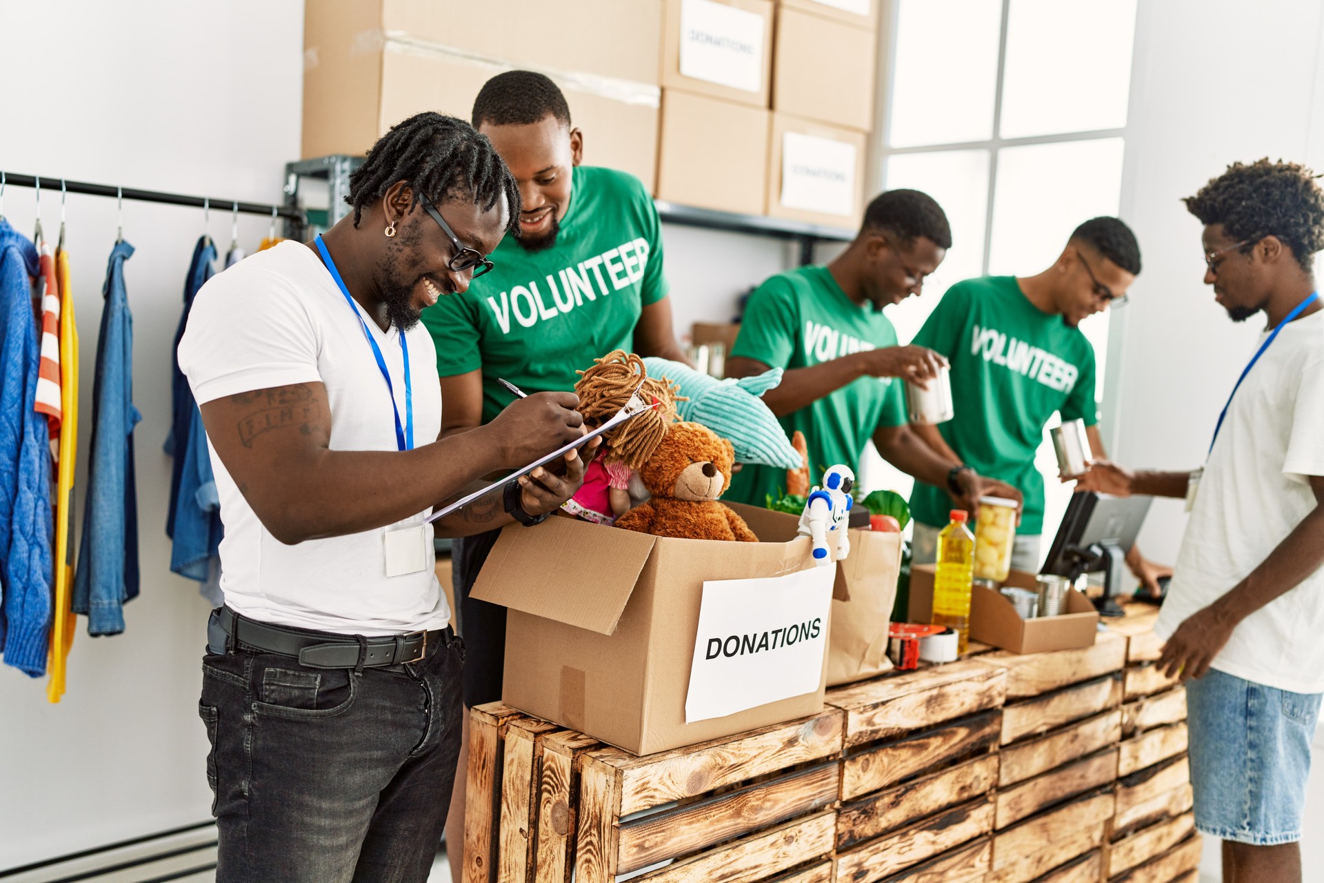 Group of volunteers working at charity center.